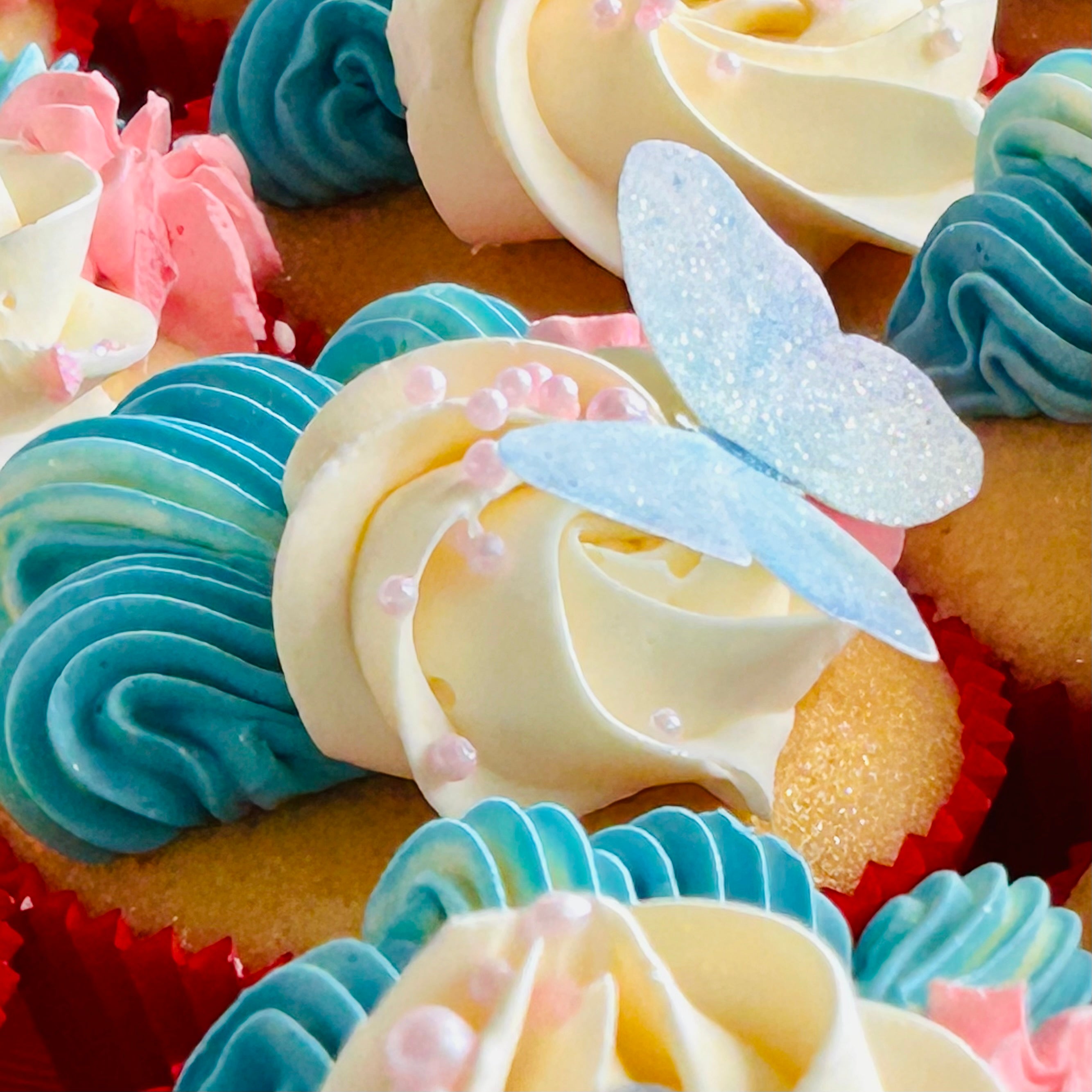 Vanilla cupcakes decorated with wafer paper butterflies