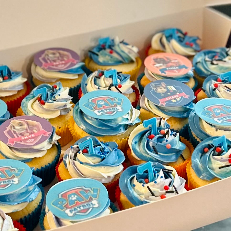 Vanilla cupcakes decorated with Paw Patrol toppers