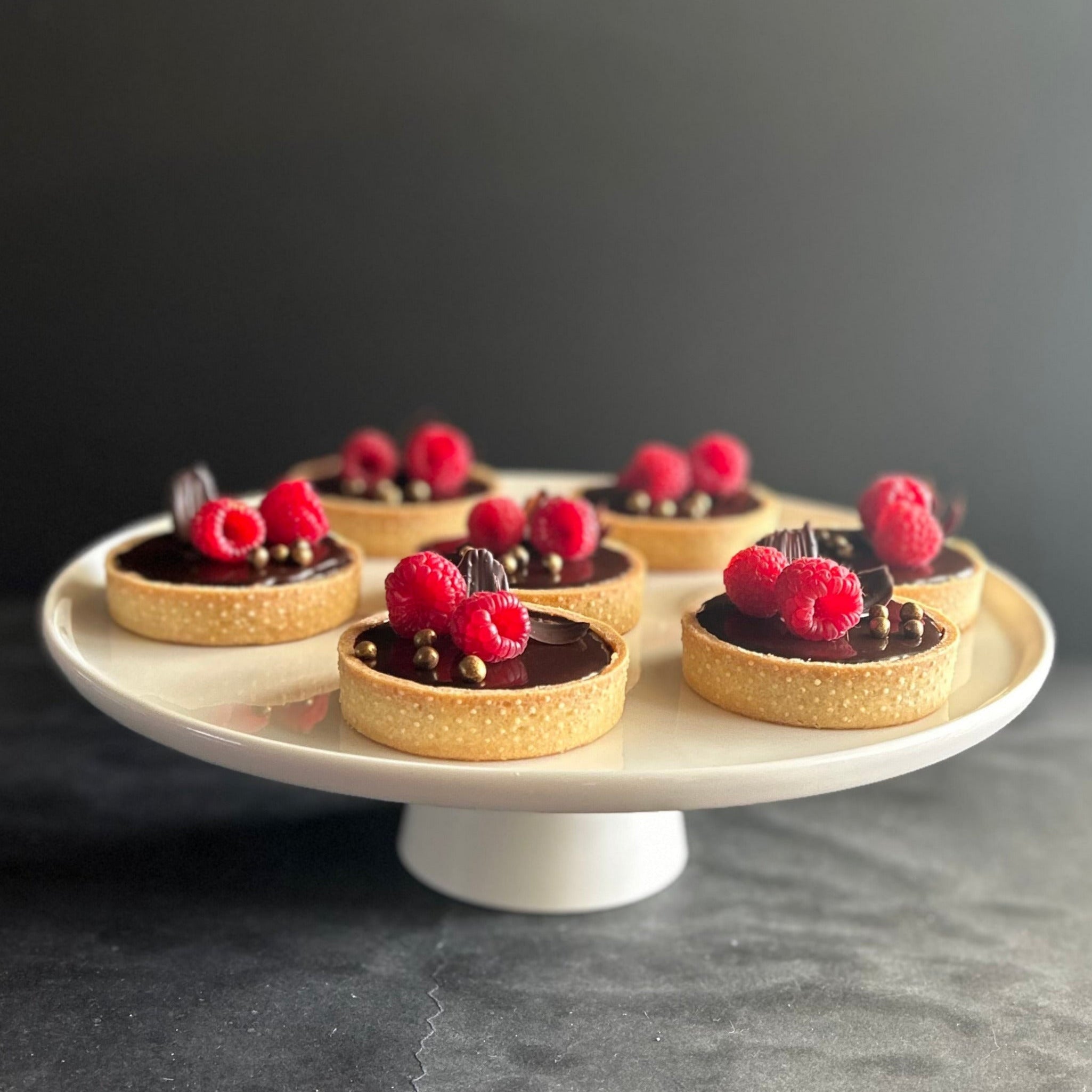 Raspberry and chocolate cremeux tarts with fresh raspberries and chocolate decorations 8cm round 
